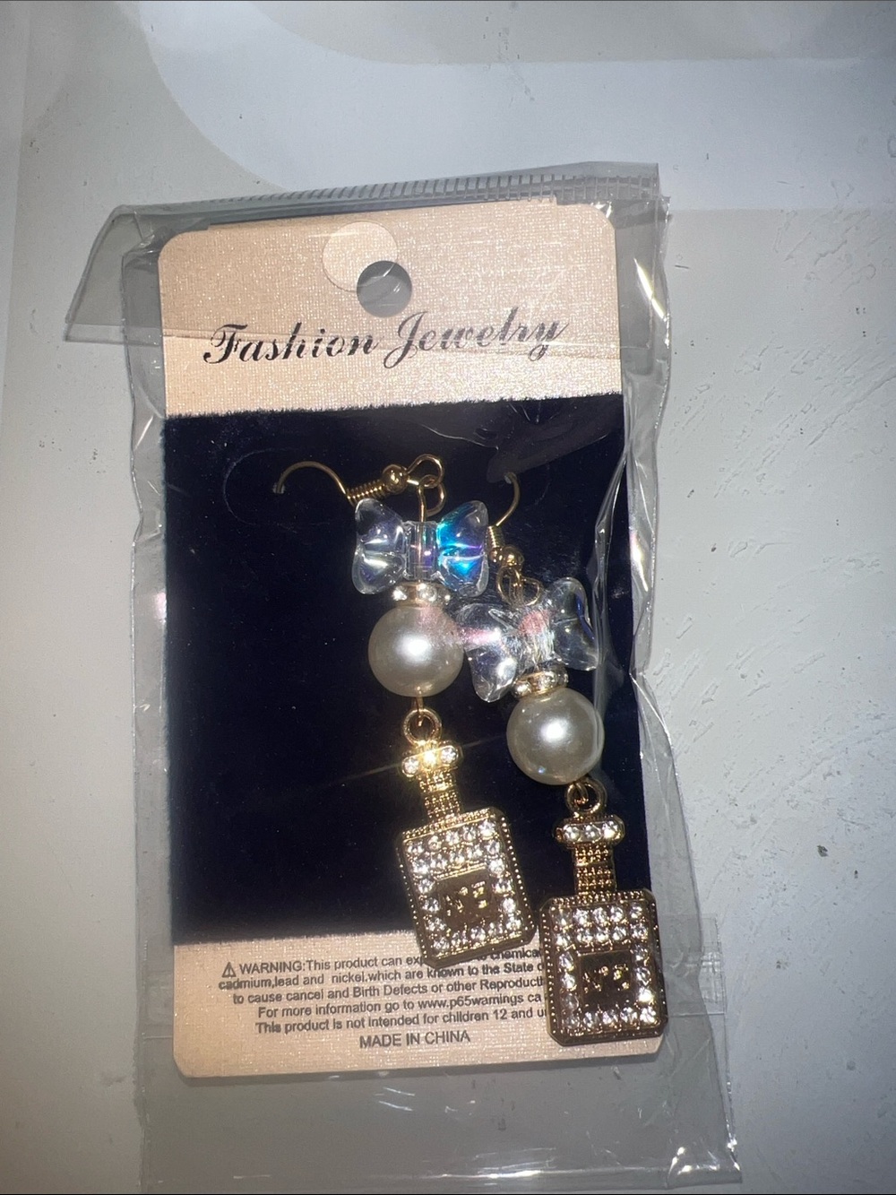 Gold Crystal Perfume Bottle Drop Earrings with Pearl and Iridescent Bow